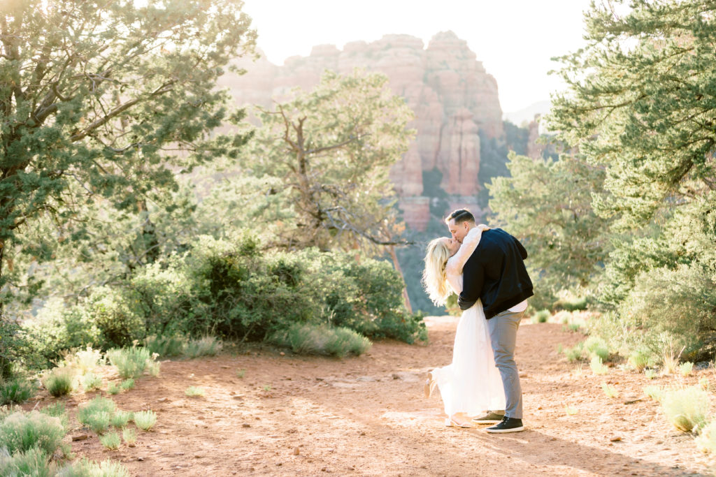 engaged couple kisses in sedona